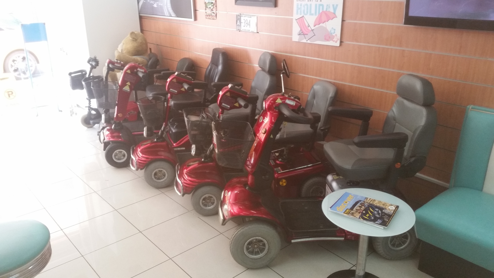 Mobility scooters parked in EasyHire Shop opposite Hotel Presidente